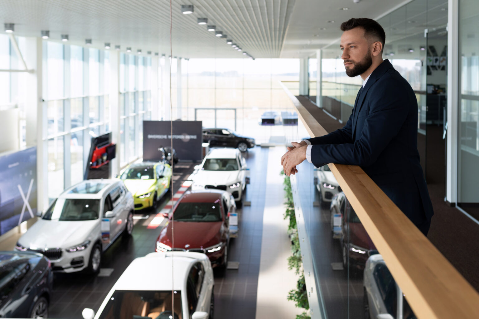 Customer viewing a car in a dealership showroom.